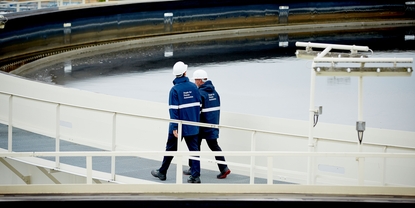 Workers at the wastewater treatment plant of a refinery